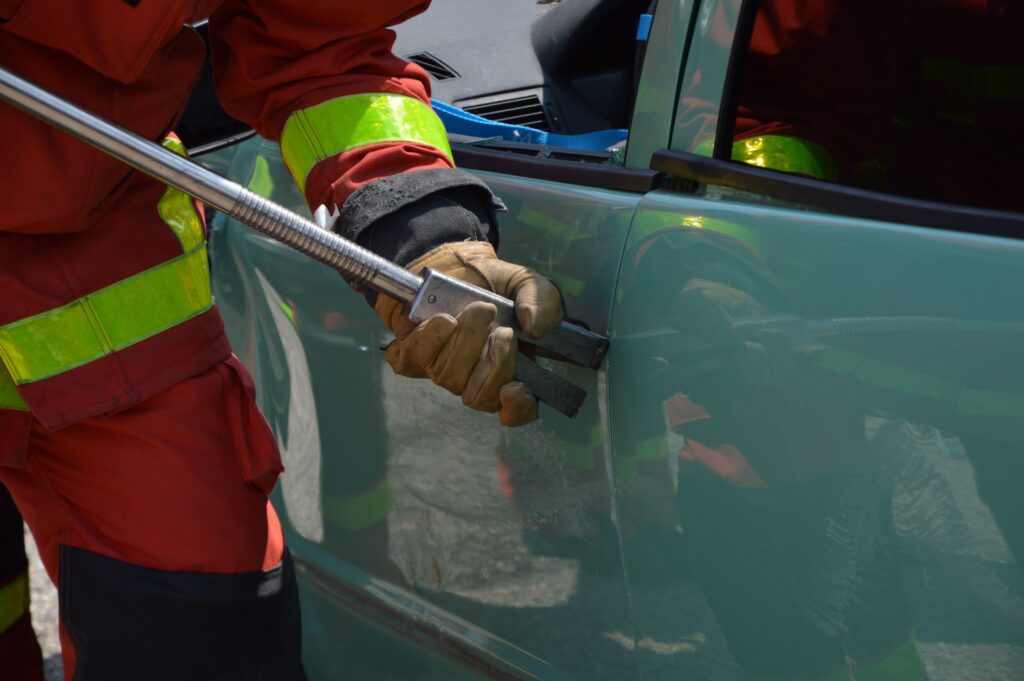 fireman help break open stuck car door