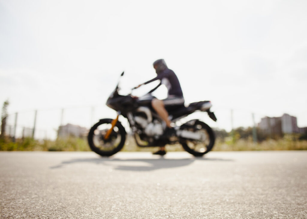person sitting on motorcycle